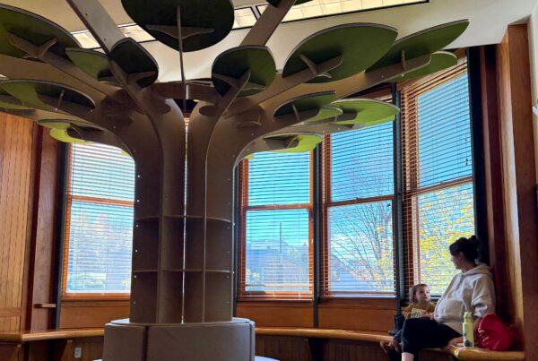 Pictured: Elaine and Maeve enjoy the latest addition to the Children's Library, our brand-new reading tree.