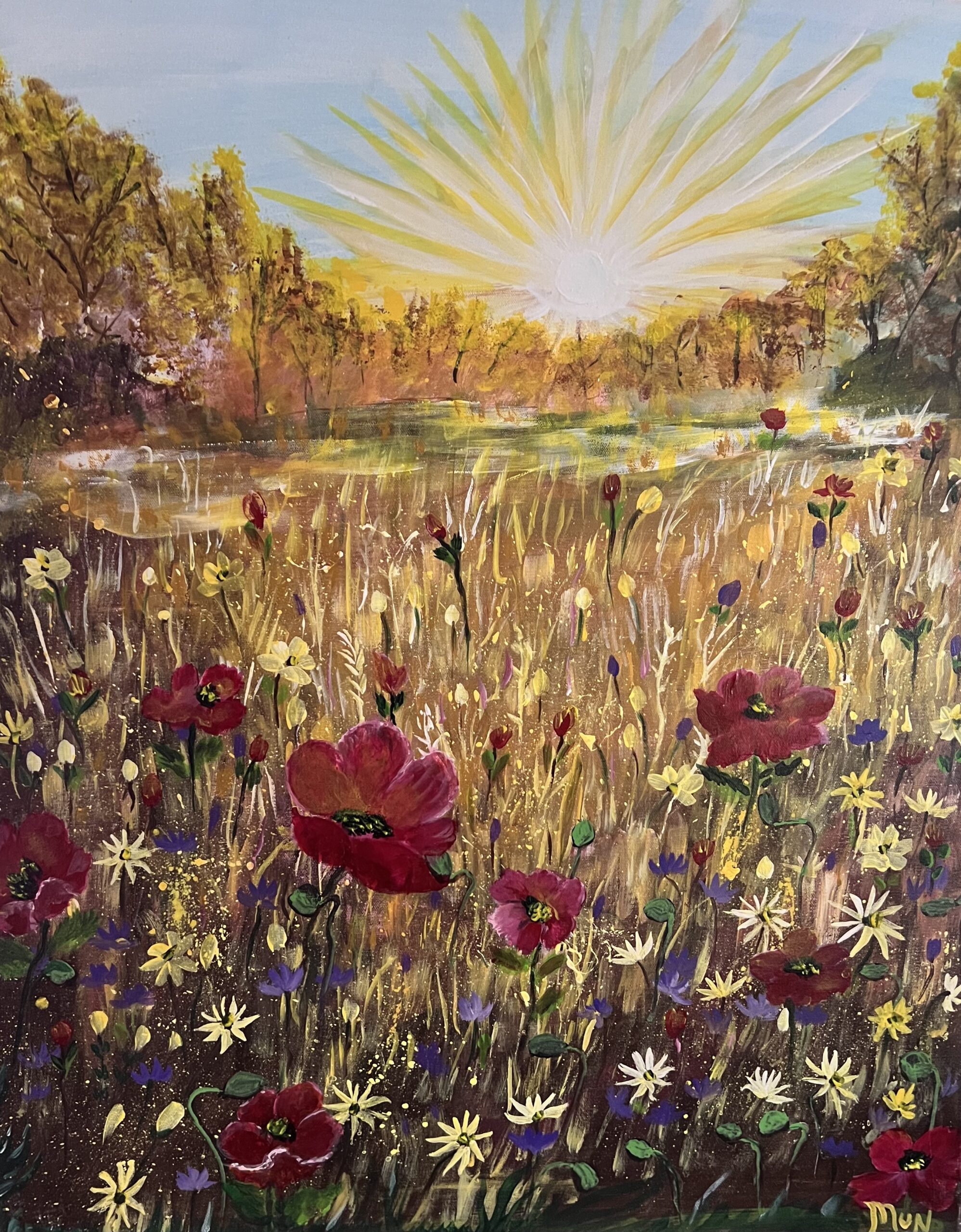 Field of flowers with sun setting.