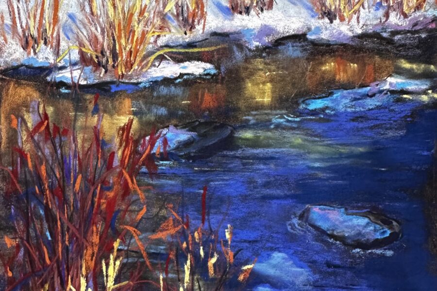 Edge of water with cattail plants and snow covered banks.